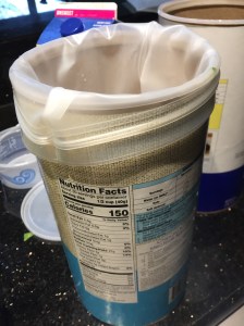 I used the empty oatmeal container to hold my freezer bags open.